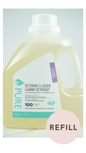 Pure brand lavender liquid laundry detergent bottle labeled '100 loads' with a REFILL badge, photographed on a marble-look surface.